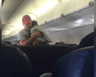 While On A Plane, Stranger Takes Crying Baby From Pregnant Mom And Comforts Him